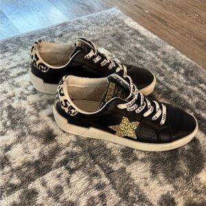 Vintage Havana Black Sneakers with Gold Star Accent